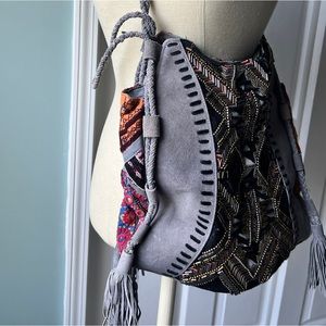 Grey patchwork bag. NOTE: Strap needs repair. See photos for any flaws.